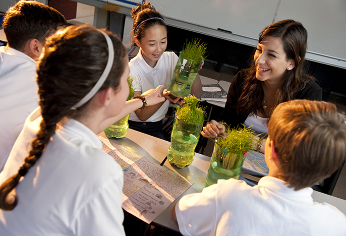 Education student Hannah Fink teaching students about plants