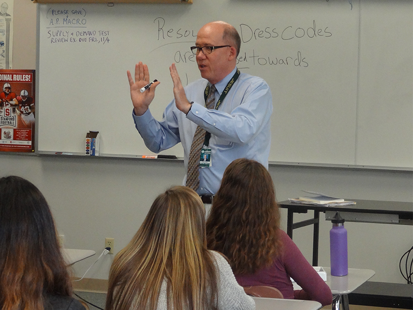 Chris Smart teaching in a HS classroom.